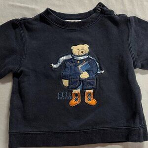 Elle - pullover sweatshirt with bear design on the front.